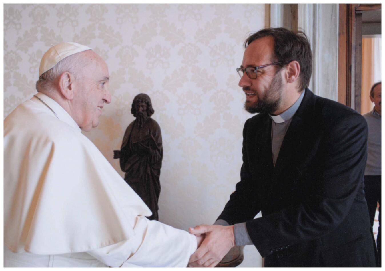 Pope Francis shakes hands with Bishop-elect Christian Carlassare