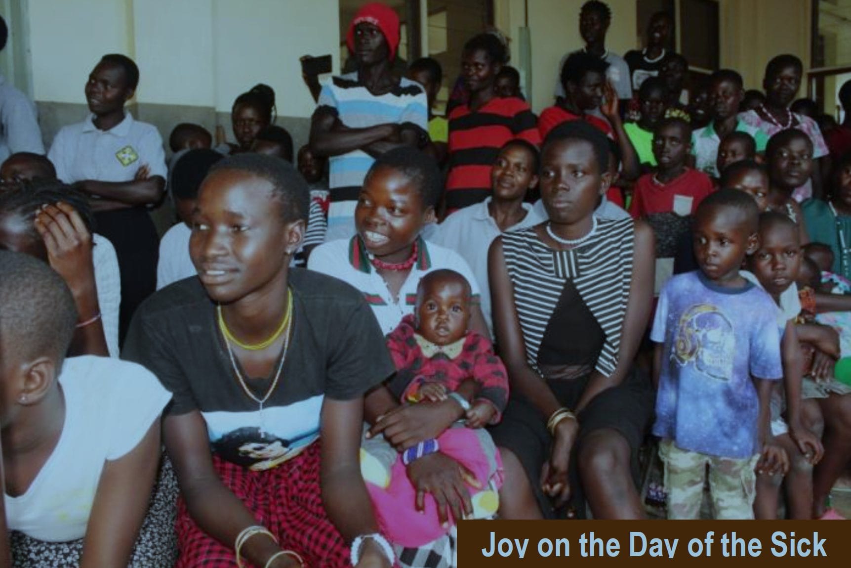 Patients and community members of St. Kizito in Matany Uganda pray during the day of the sick