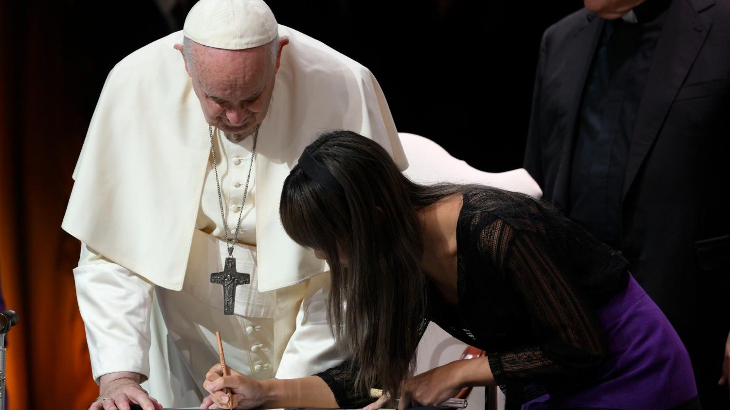 Pope Francis signs the Economy of Francesco Covenant, which he hopes will build “an economy of the Gospel.”