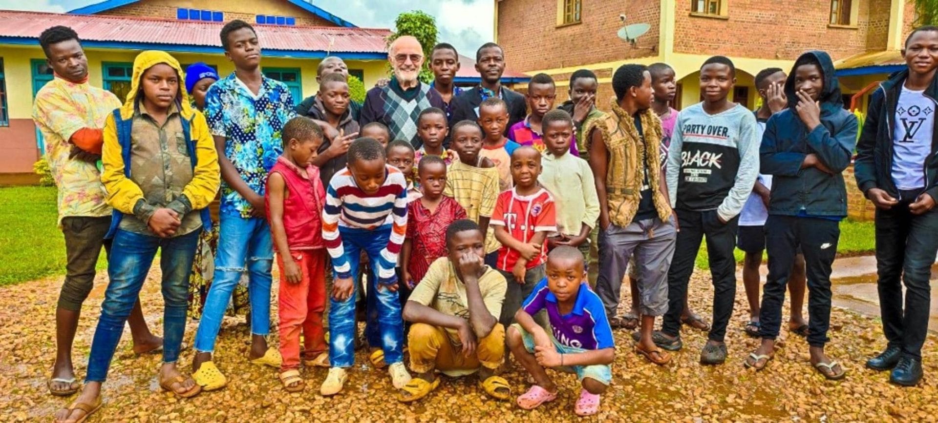 Fr Pezzi stands with parishioners in Butembo