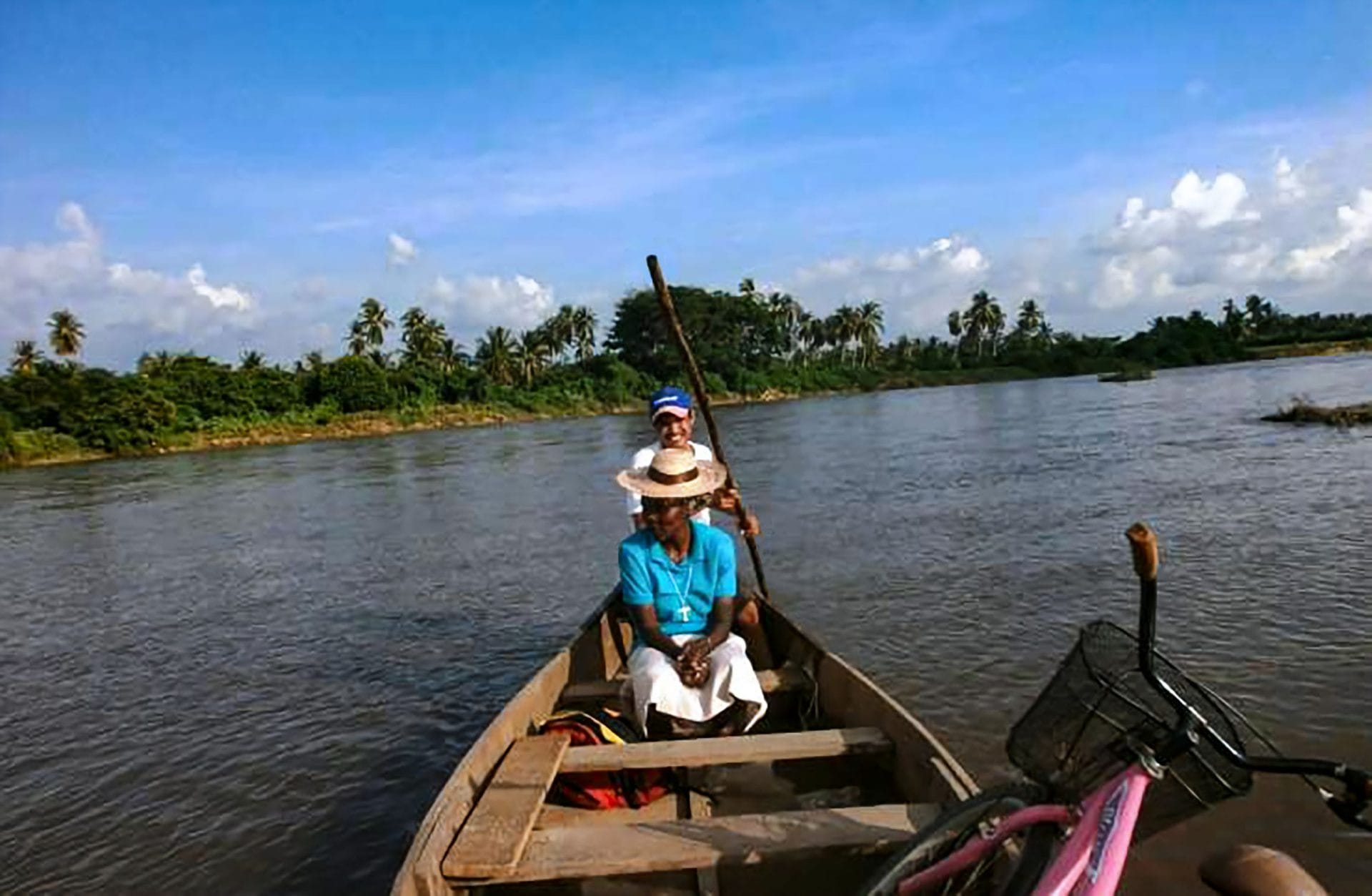 Sister Isabelle Kahambu Valinande sits on a boat on a river in the Congo