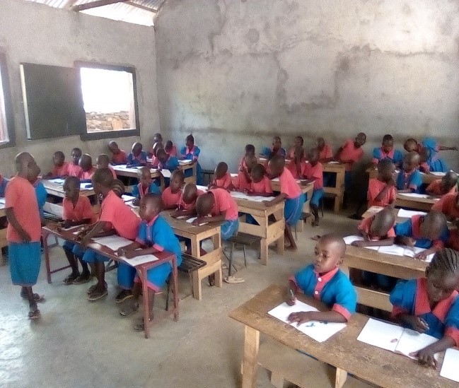 Students at St Daniel Nursery School sit at their desks